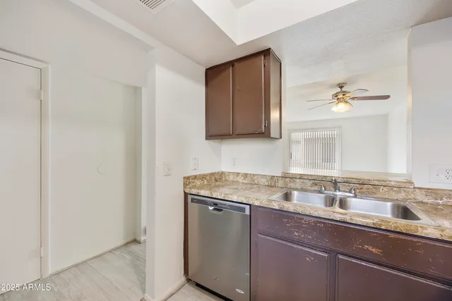 a view of a kitchen with granite countertop