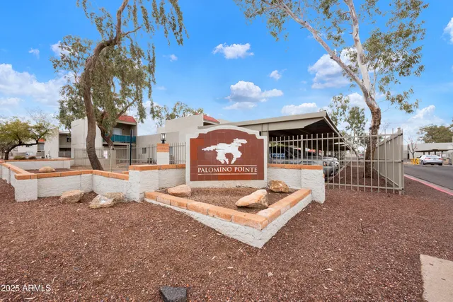 a swimming pool with outdoor seating and yard