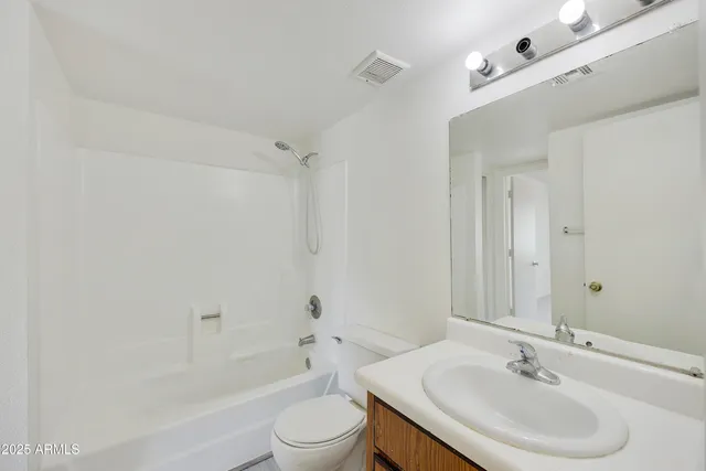 a view of a hallway with washer and dryer