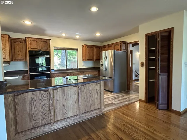 a view of kitchen with sink and microwave