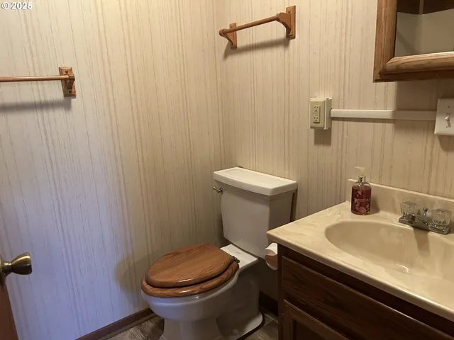 a view of balcony with wooden floor and fence