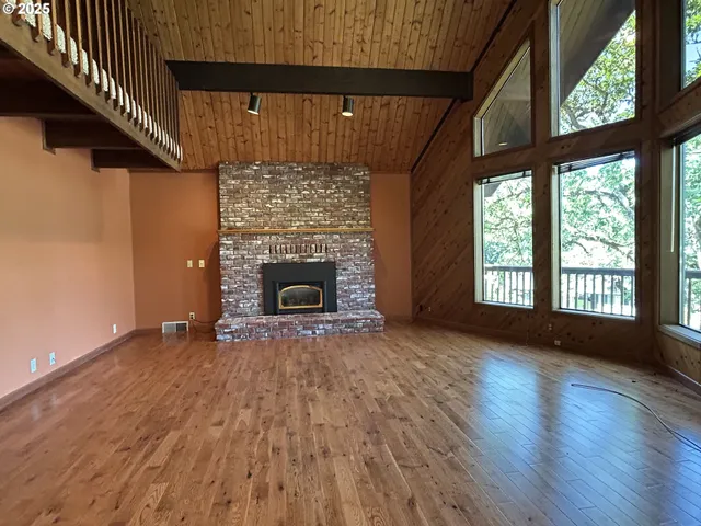 a kitchen with stainless steel appliances granite countertop a stove a sink dishwasher and a refrigerator