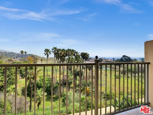 a view of a balcony next to a lake view