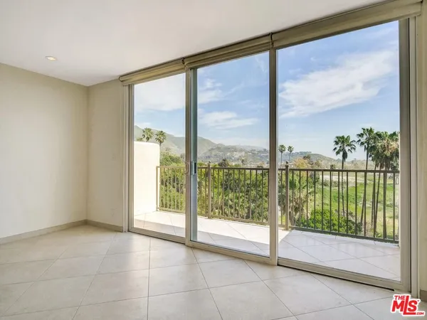 a view of a glass door and a window
