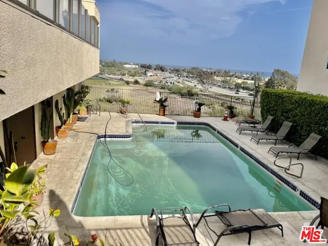 a view of a swimming pool with a terrace