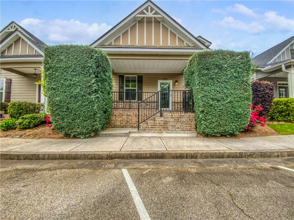 4552 Silver Springs Boulevard Powder Springs, GA 30127 - Photo 1 of 1 a front view of a house with garden