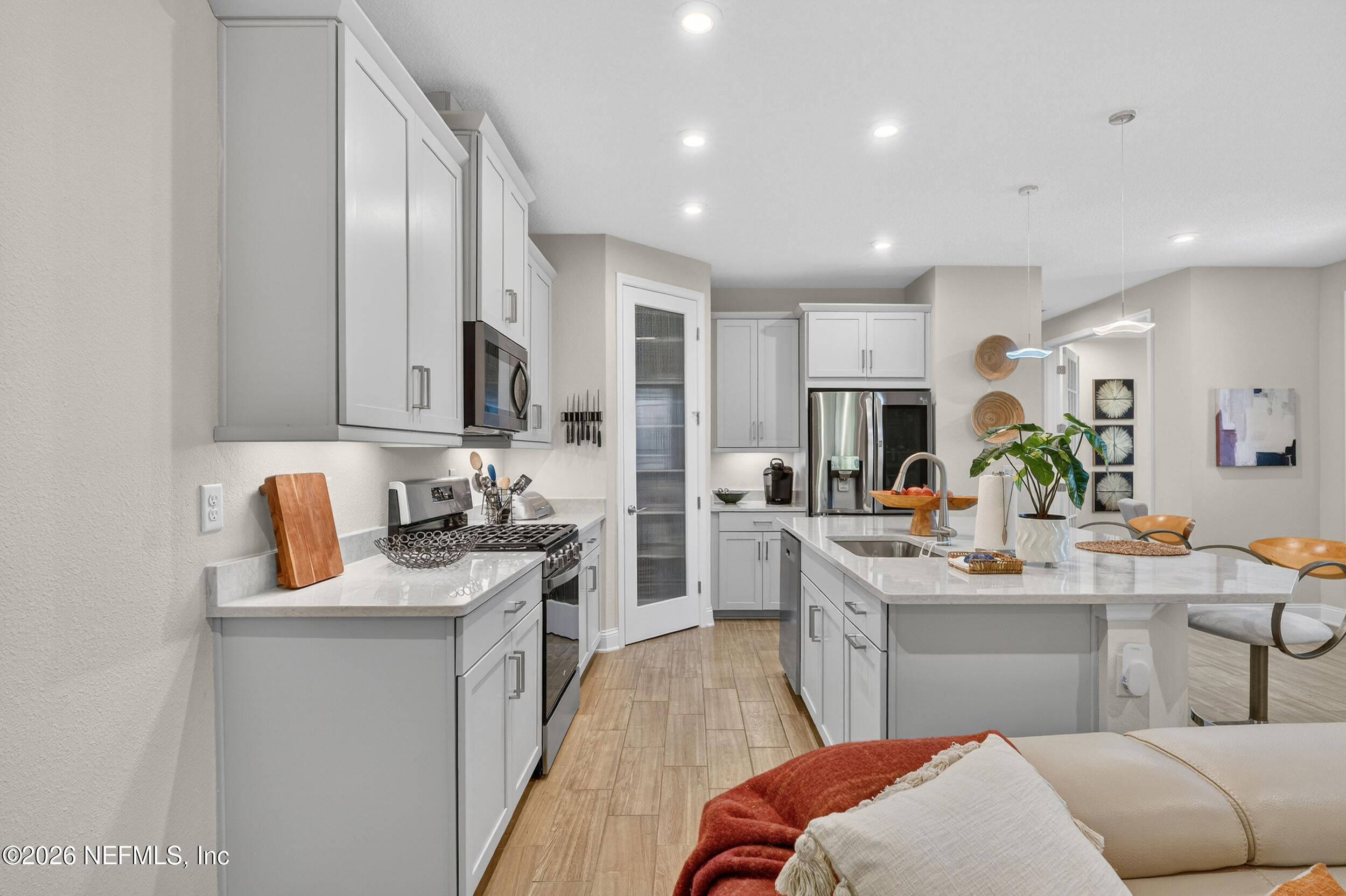 59 Fly Line Drive St. Johns, FL 32259 - Photo 11 of 60 a kitchen with stainless steel appliances granite countertop a sink dishwasher stove refrigerator and cabinets