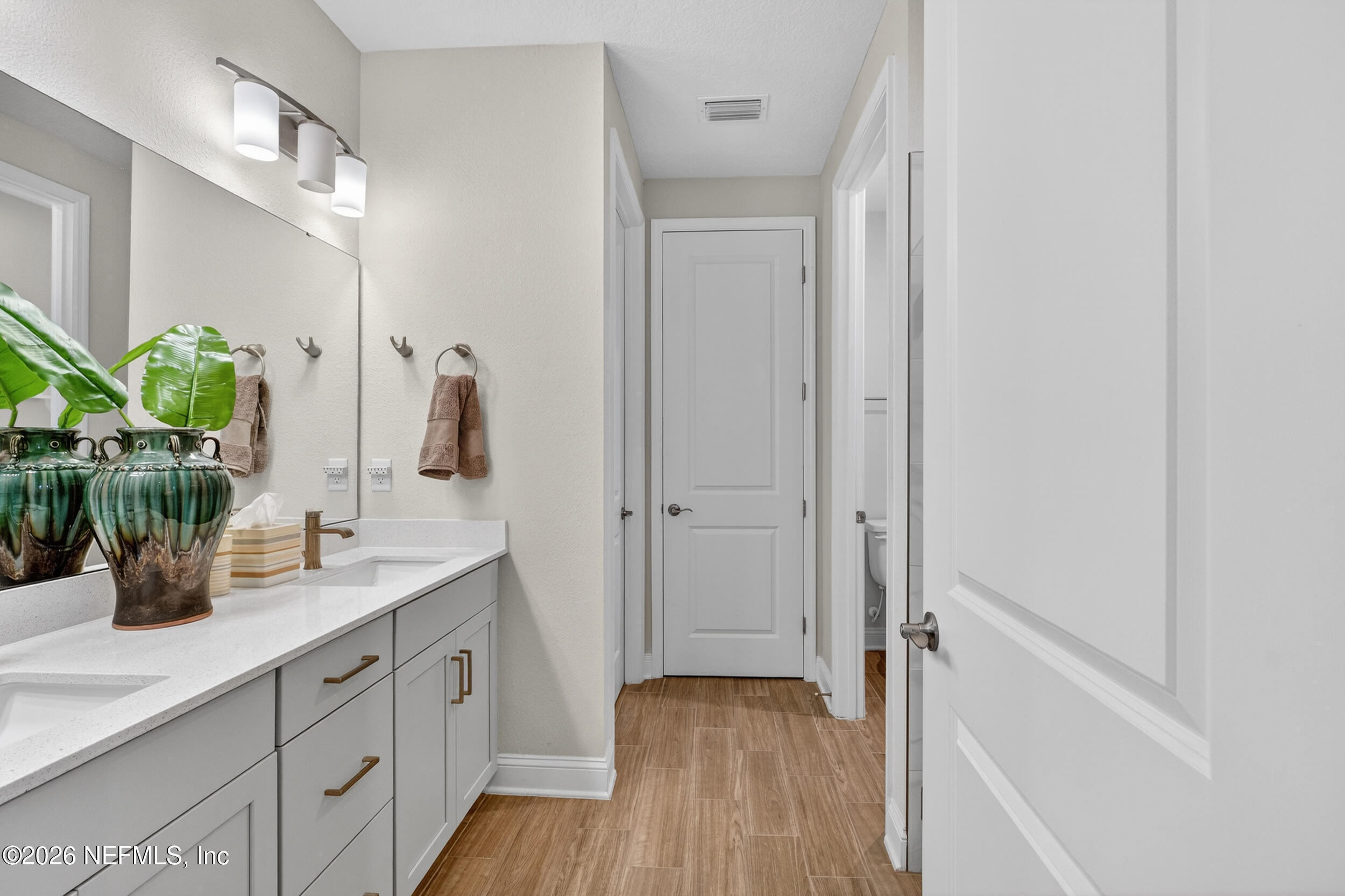 59 Fly Line Drive St. Johns, FL 32259 - Photo 20 of 60 a bathroom with a double vanity sink and a mirror