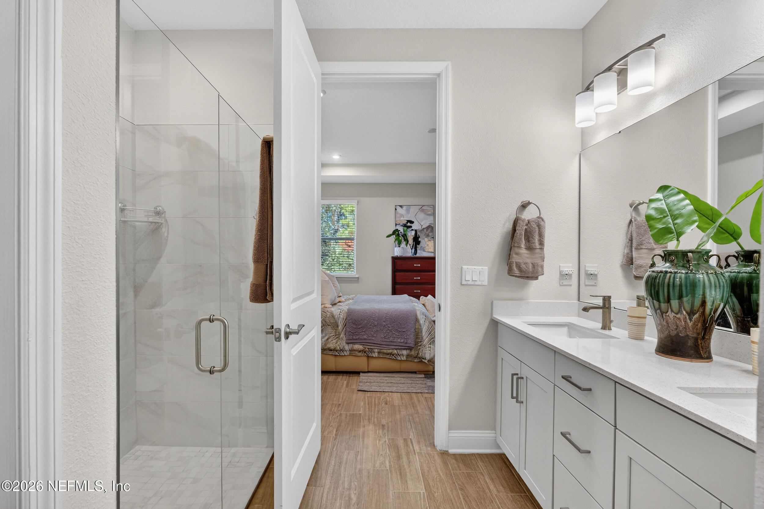 59 Fly Line Drive St. Johns, FL 32259 - Photo 21 of 60 a bathroom with a double vanity sink and shower