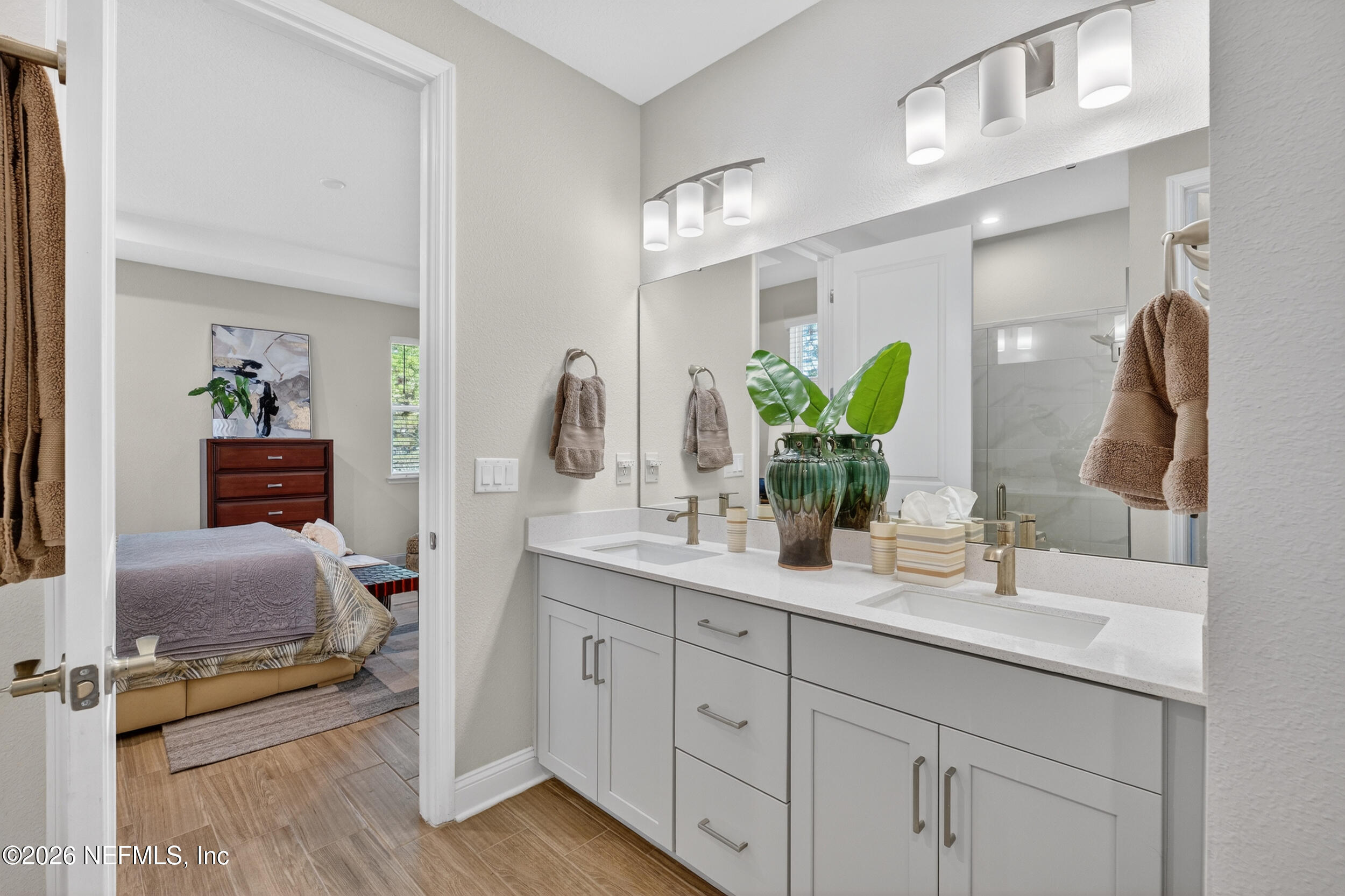 59 Fly Line Drive St. Johns, FL 32259 - Photo 22 of 60 a en suite bathroom with double vanity sinks and a mirror