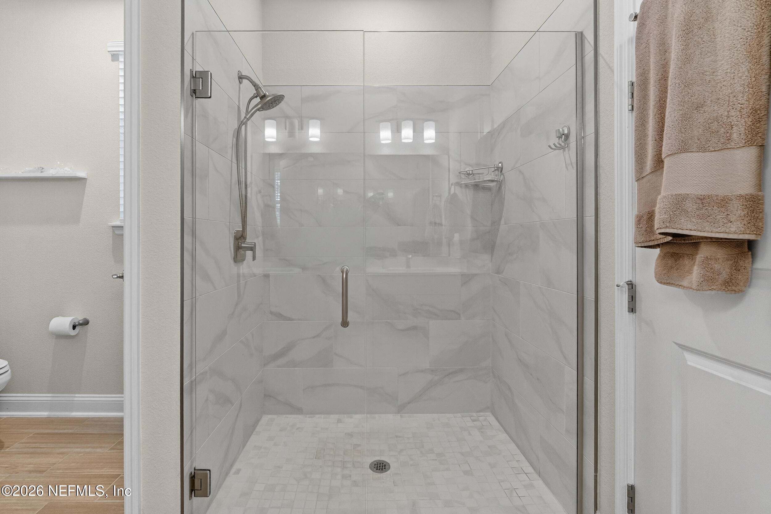 59 Fly Line Drive St. Johns, FL 32259 - Photo 25 of 60 a bathroom with a glass shower door