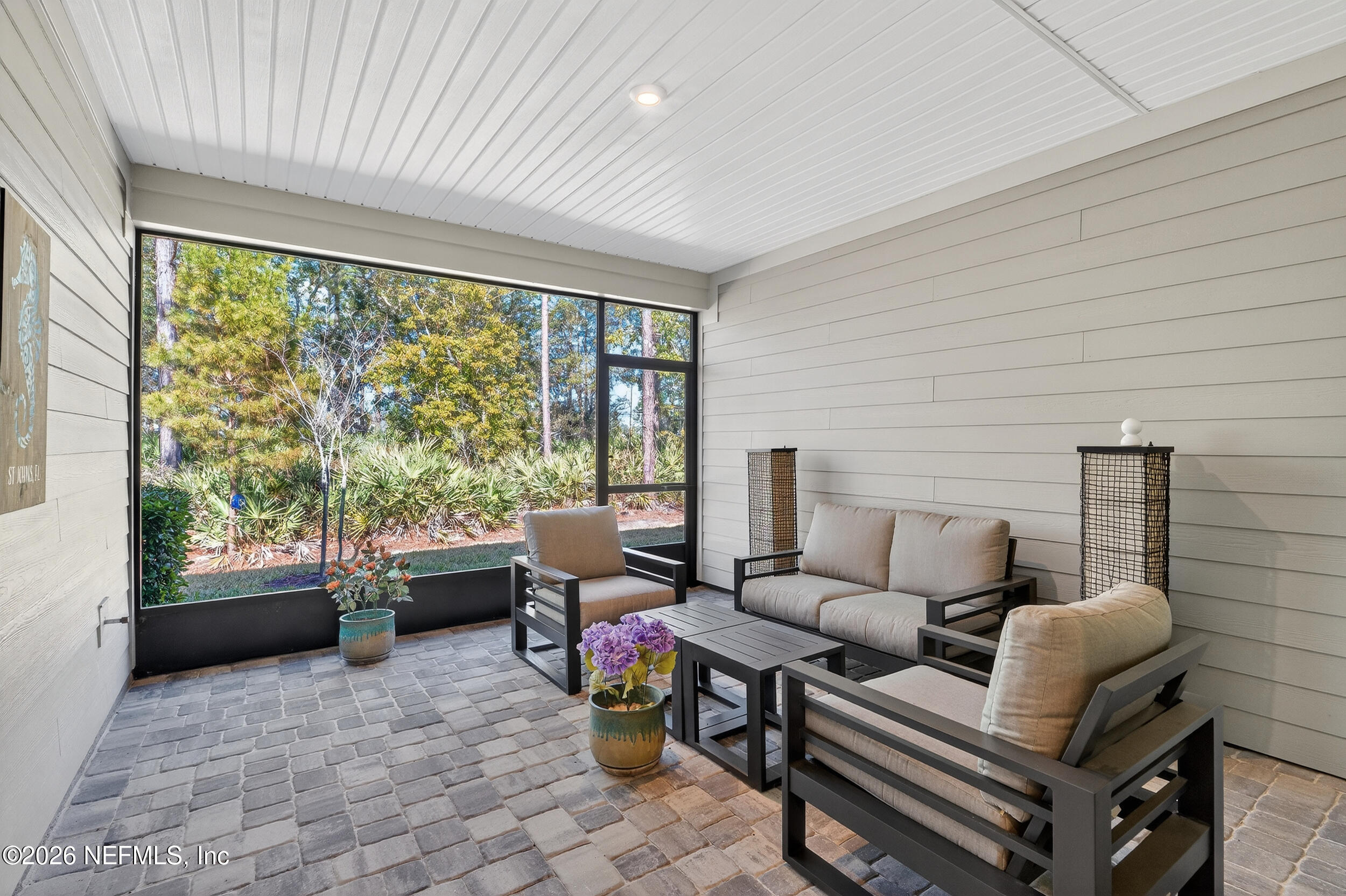 59 Fly Line Drive St. Johns, FL 32259 - Photo 30 of 60 a living room with furniture and a floor to ceiling window