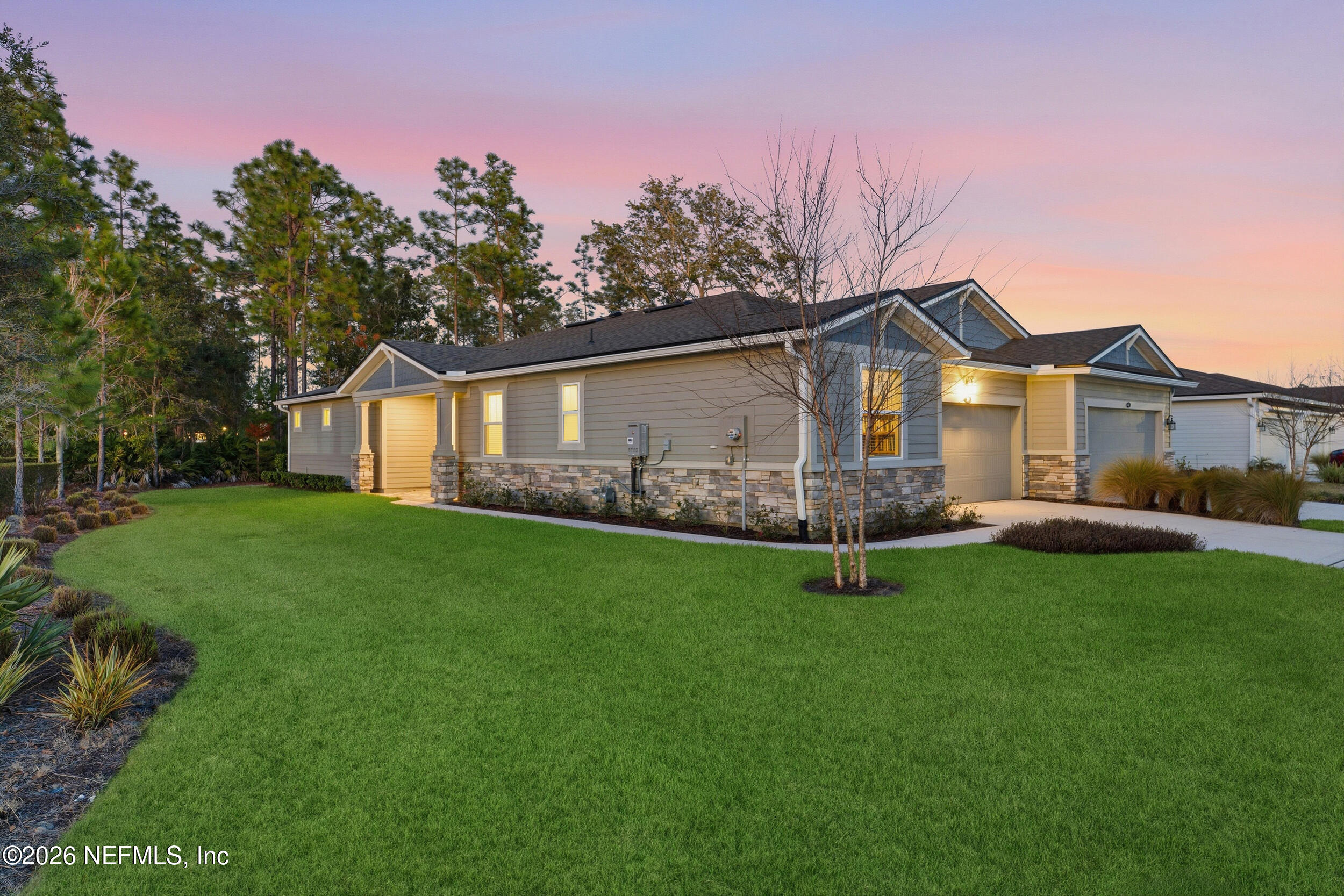 59 Fly Line Drive St. Johns, FL 32259 - Photo 33 of 60 a front view of a house with garden