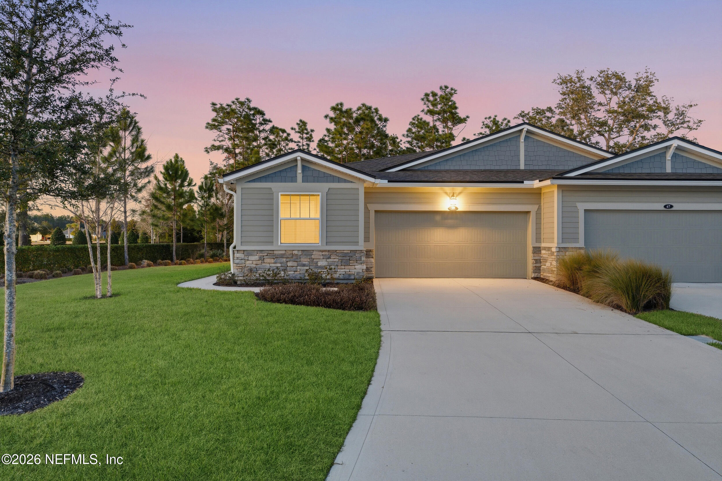 59 Fly Line Drive St. Johns, FL 32259 - Photo 34 of 60 a front view of a house with a yard and garage