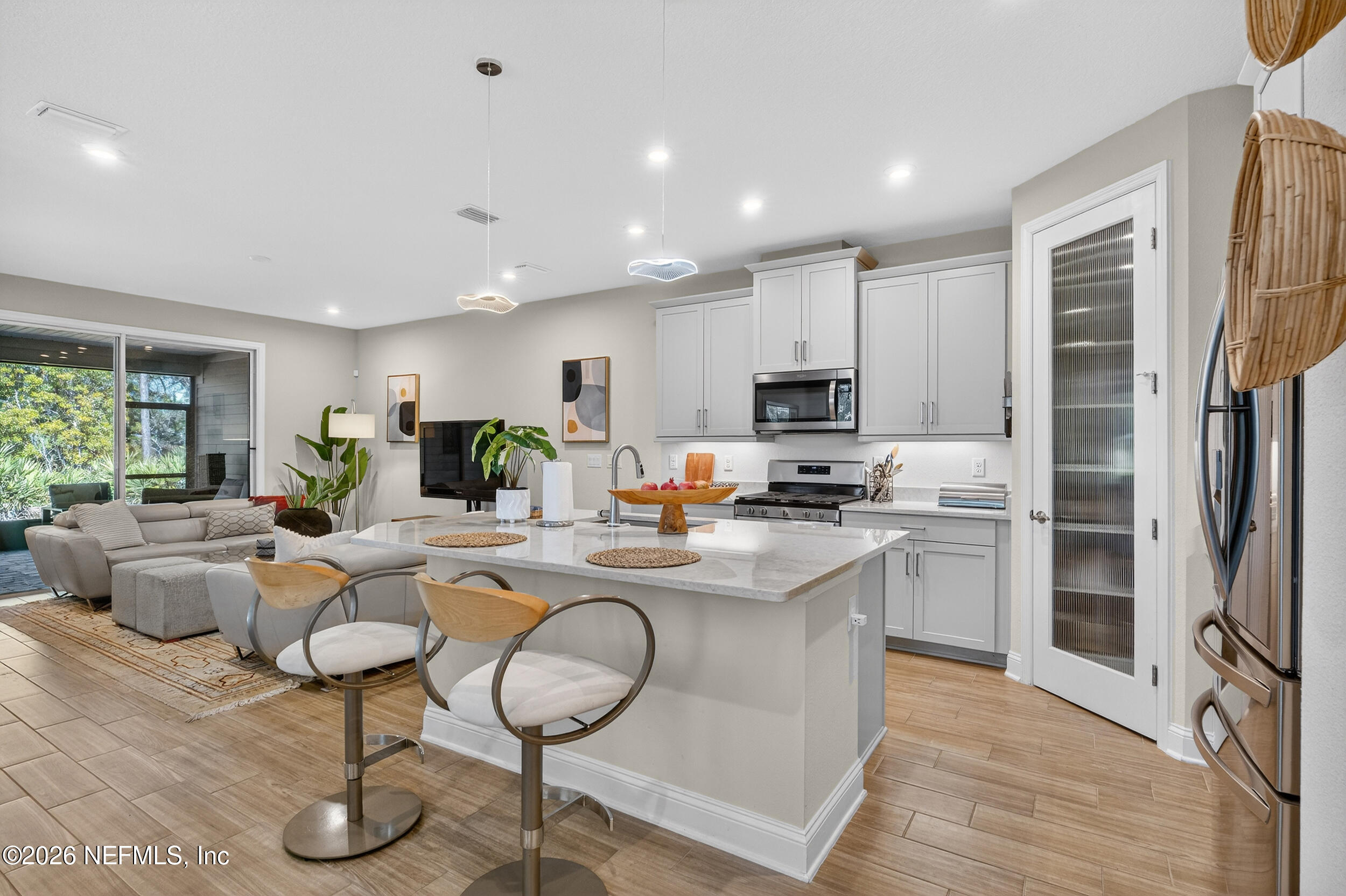 59 Fly Line Drive St. Johns, FL 32259 - Photo 4 of 60 a view of kitchen with microwave and refrigerator