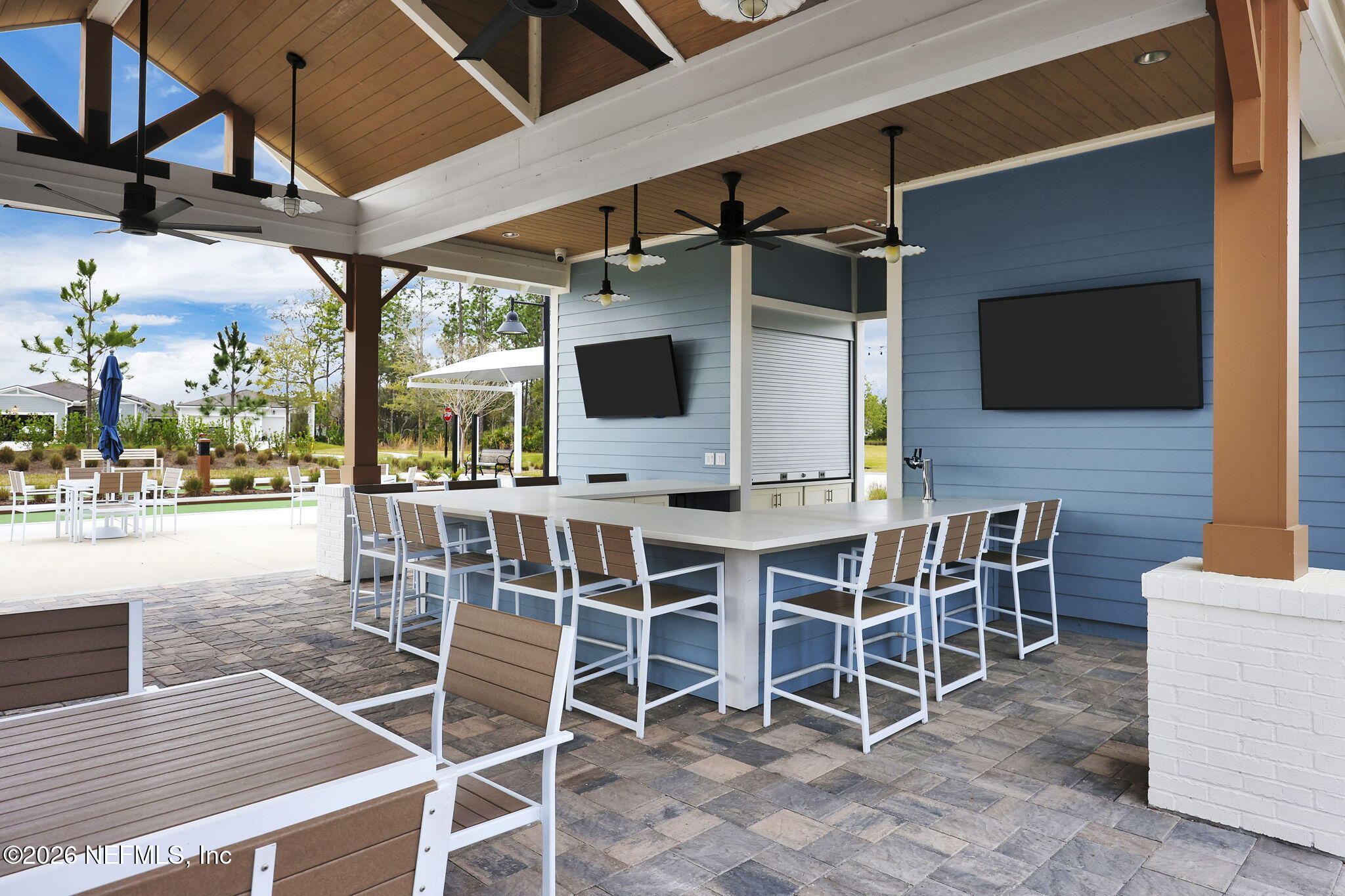 59 Fly Line Drive St. Johns, FL 32259 - Photo 45 of 60 a view of a dinning table and chairs in the patio