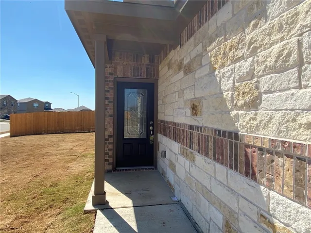 a view of balcony with wooden floor