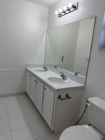 a bathroom with a sink and mirror