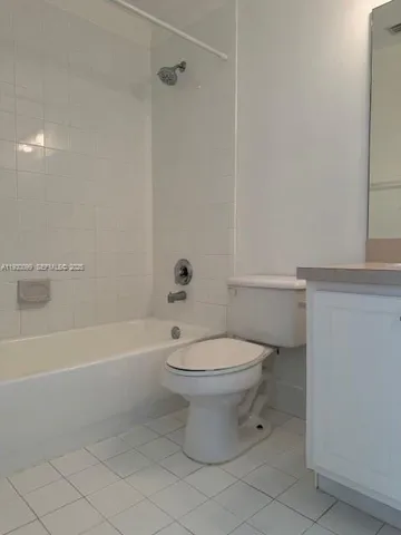 a bathroom with a toilet a sink and bathtub