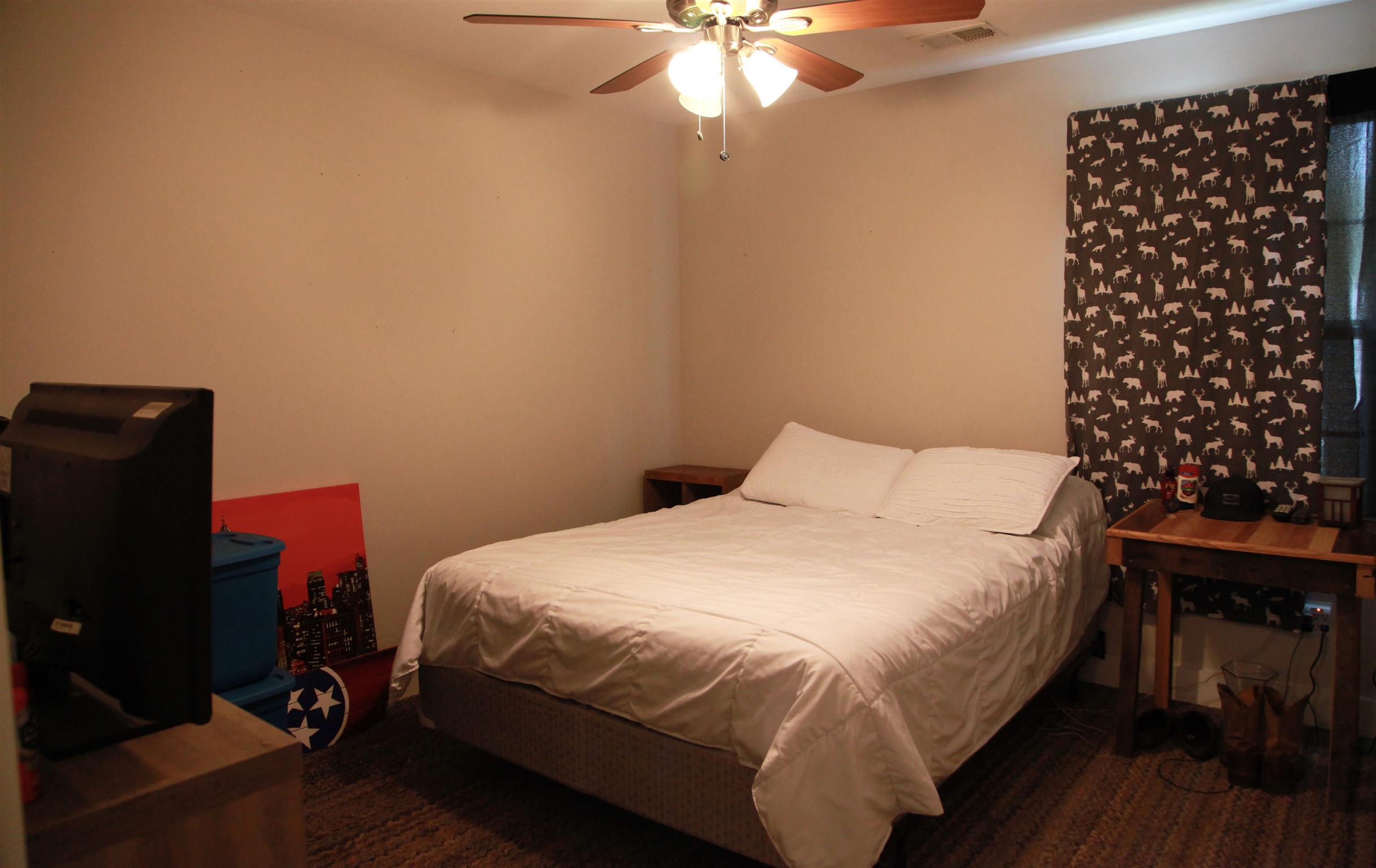 1013 Ridge Trail Goodlettsville, TN 37072 - Photo 12 of 17 a bedroom with a bed and a chandelier