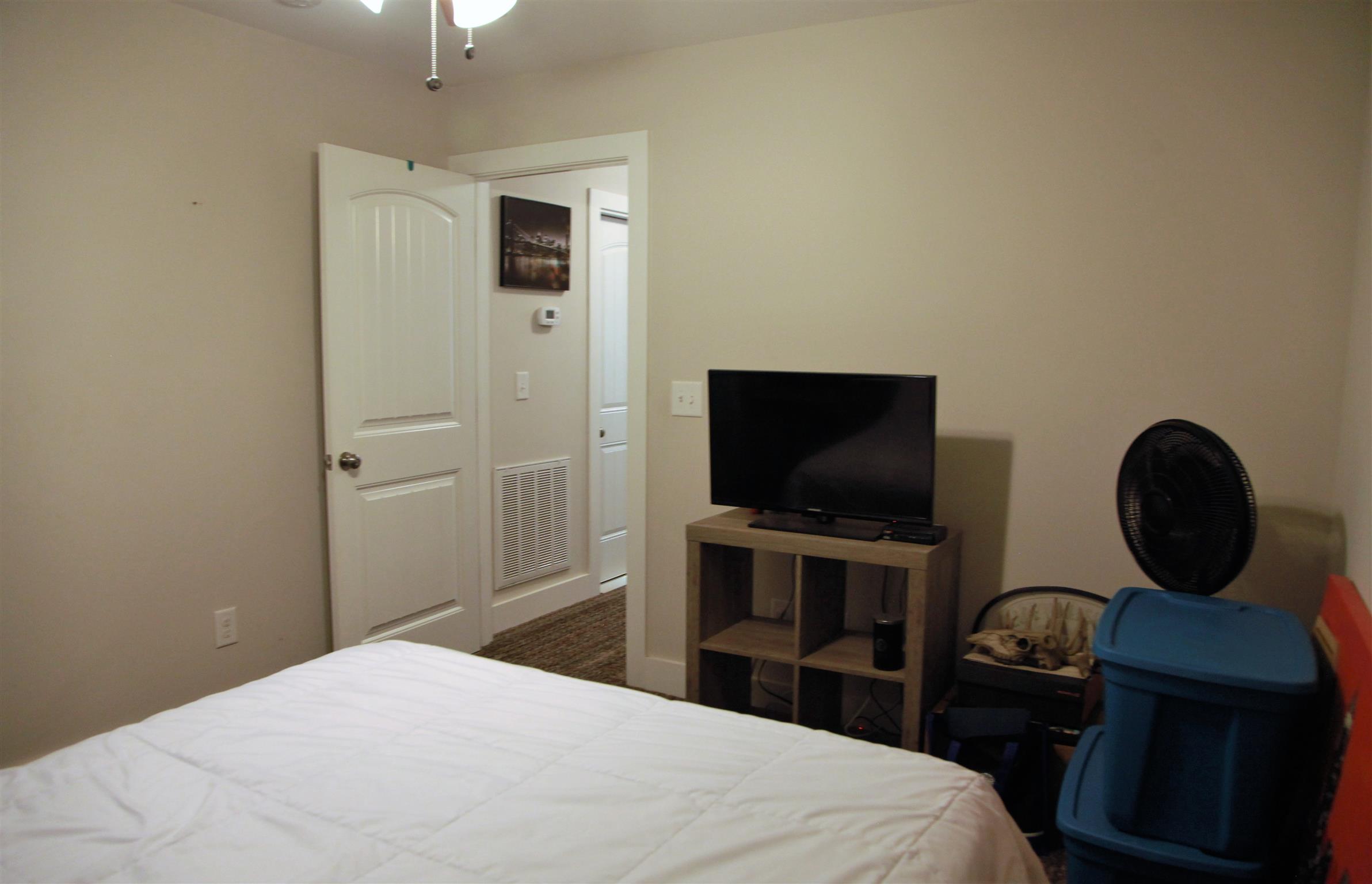 1013 Ridge Trail Goodlettsville, TN 37072 - Photo 13 of 17 a bedroom with a bed and a flat screen tv