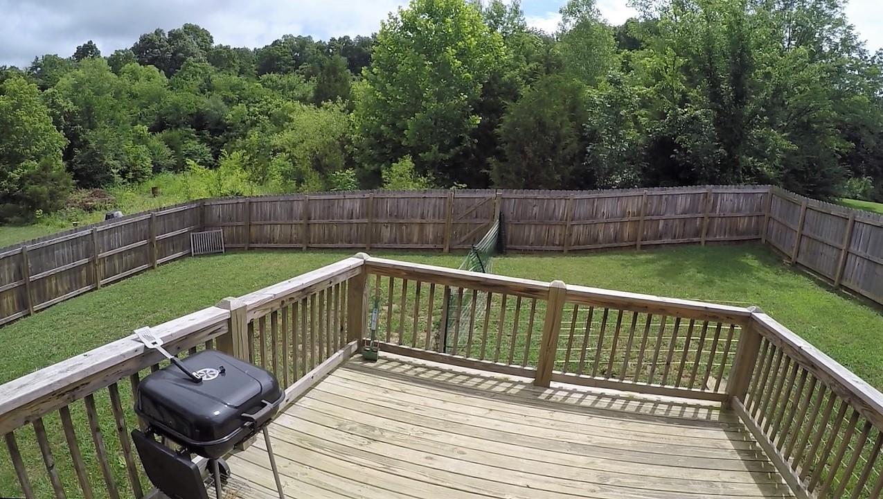 1013 Ridge Trail Goodlettsville, TN 37072 - Photo 16 of 17 a view of a deck with two chair and wooden floor