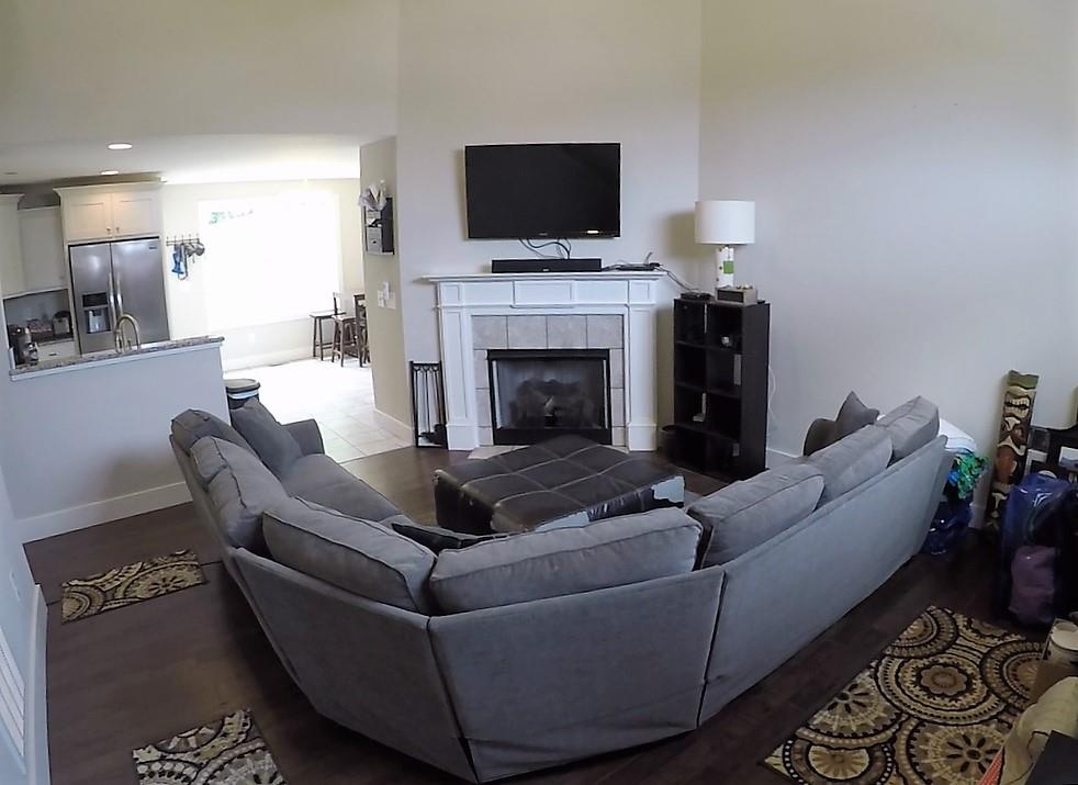 1013 Ridge Trail Goodlettsville, TN 37072 - Photo 2 of 17 a living room with furniture a flat screen tv and a fireplace