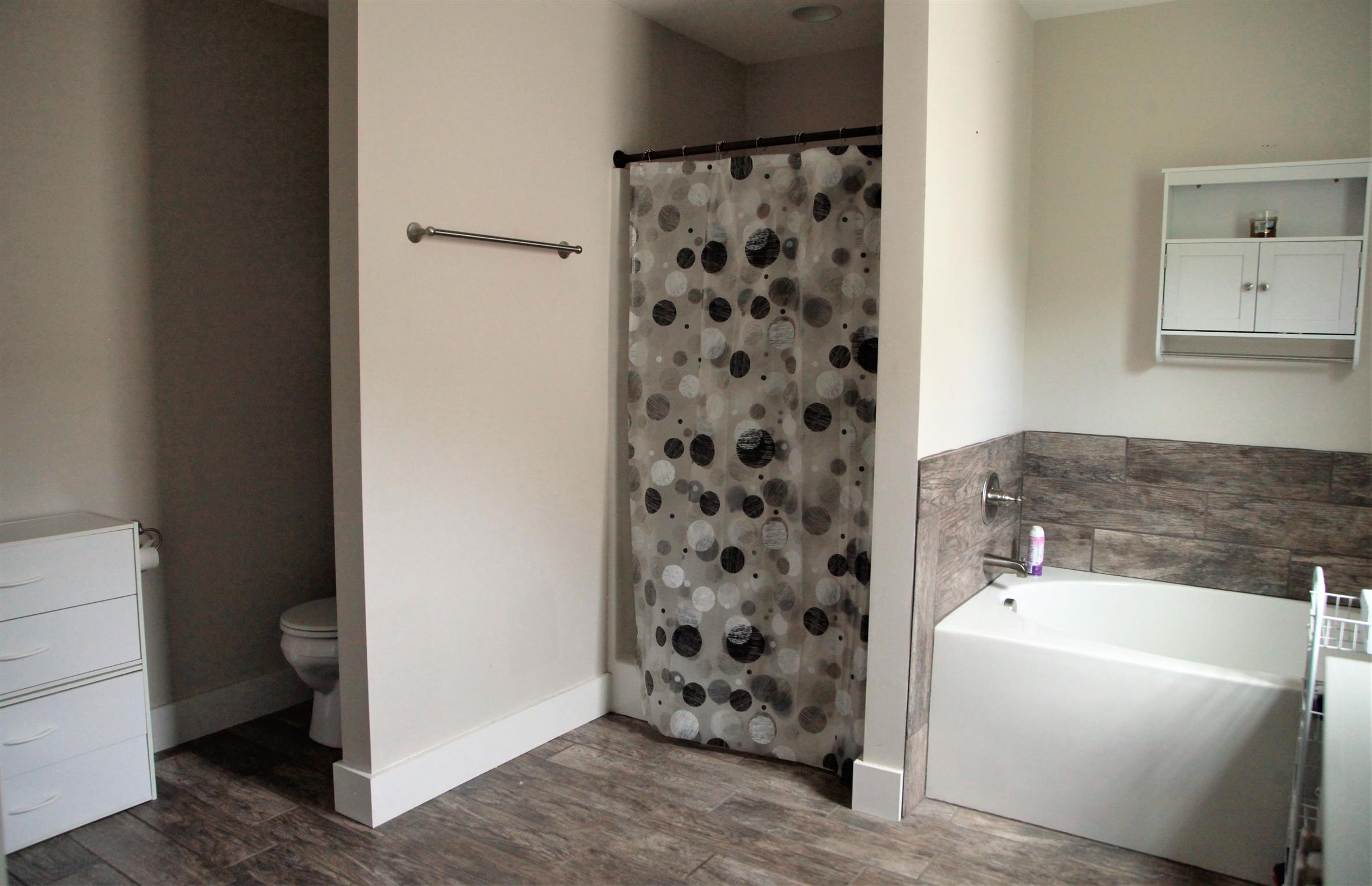 1013 Ridge Trail Goodlettsville, TN 37072 - Photo 8 of 17 a bathroom with a bathtub and a shower