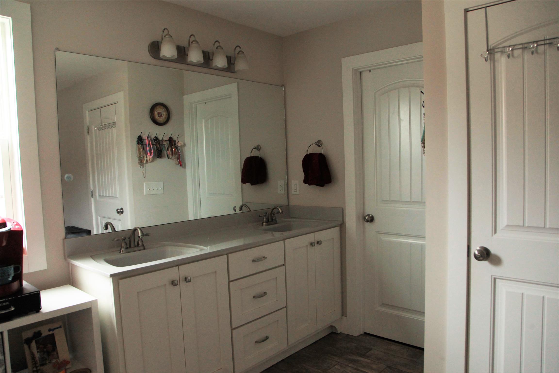 1013 Ridge Trail Goodlettsville, TN 37072 - Photo 9 of 17 a spacious bathroom with a granite countertop sink mirror and shower