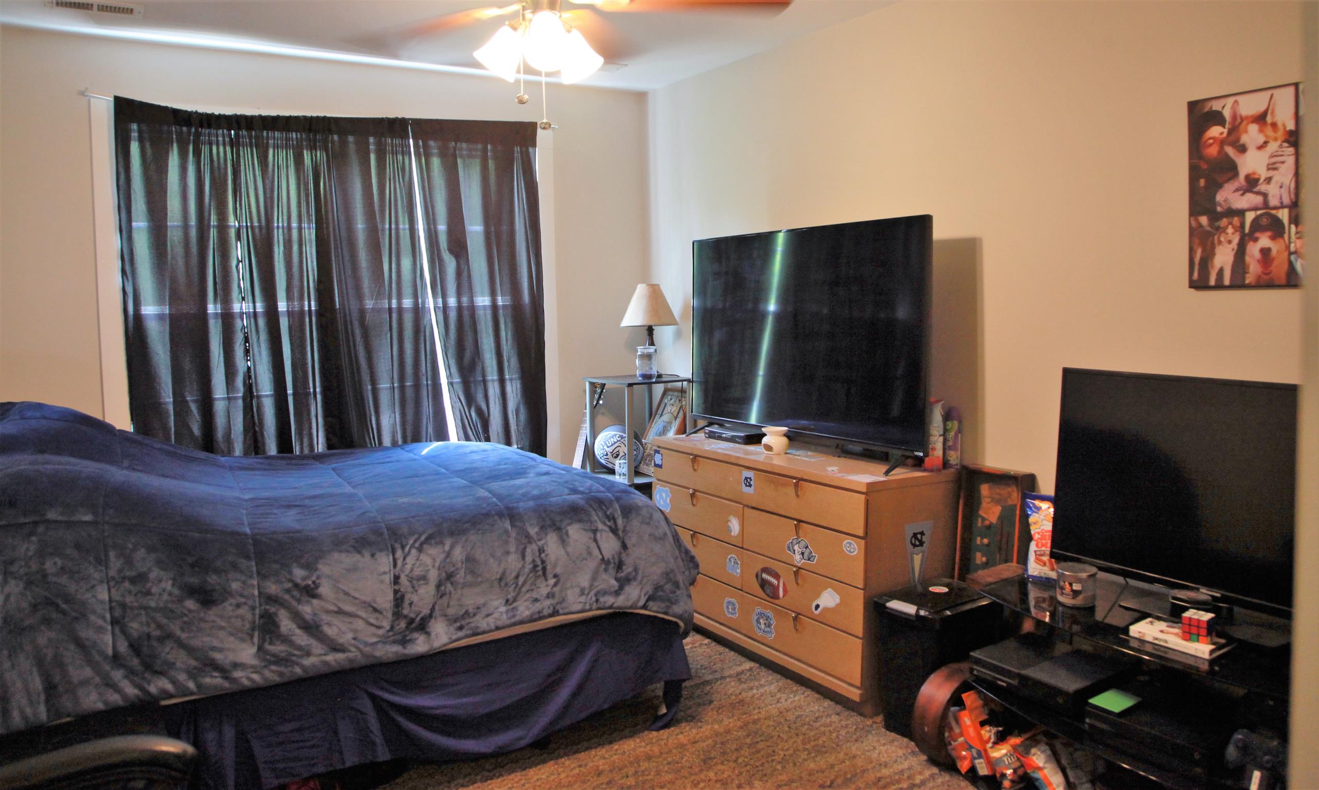 1013 Ridge Trail Goodlettsville, TN 37072 - Photo 10 of 17 a bedroom with a bed and a flat screen tv