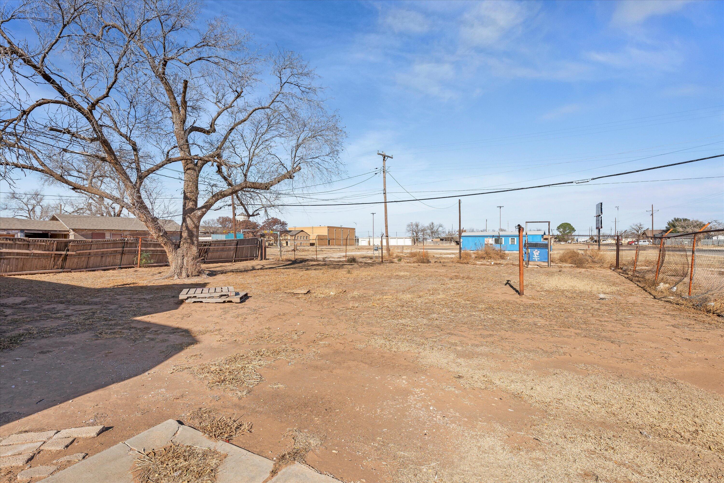 301 Austin Street Levelland, TX 79336 - Photo 17 of 18 a view of road with residential house