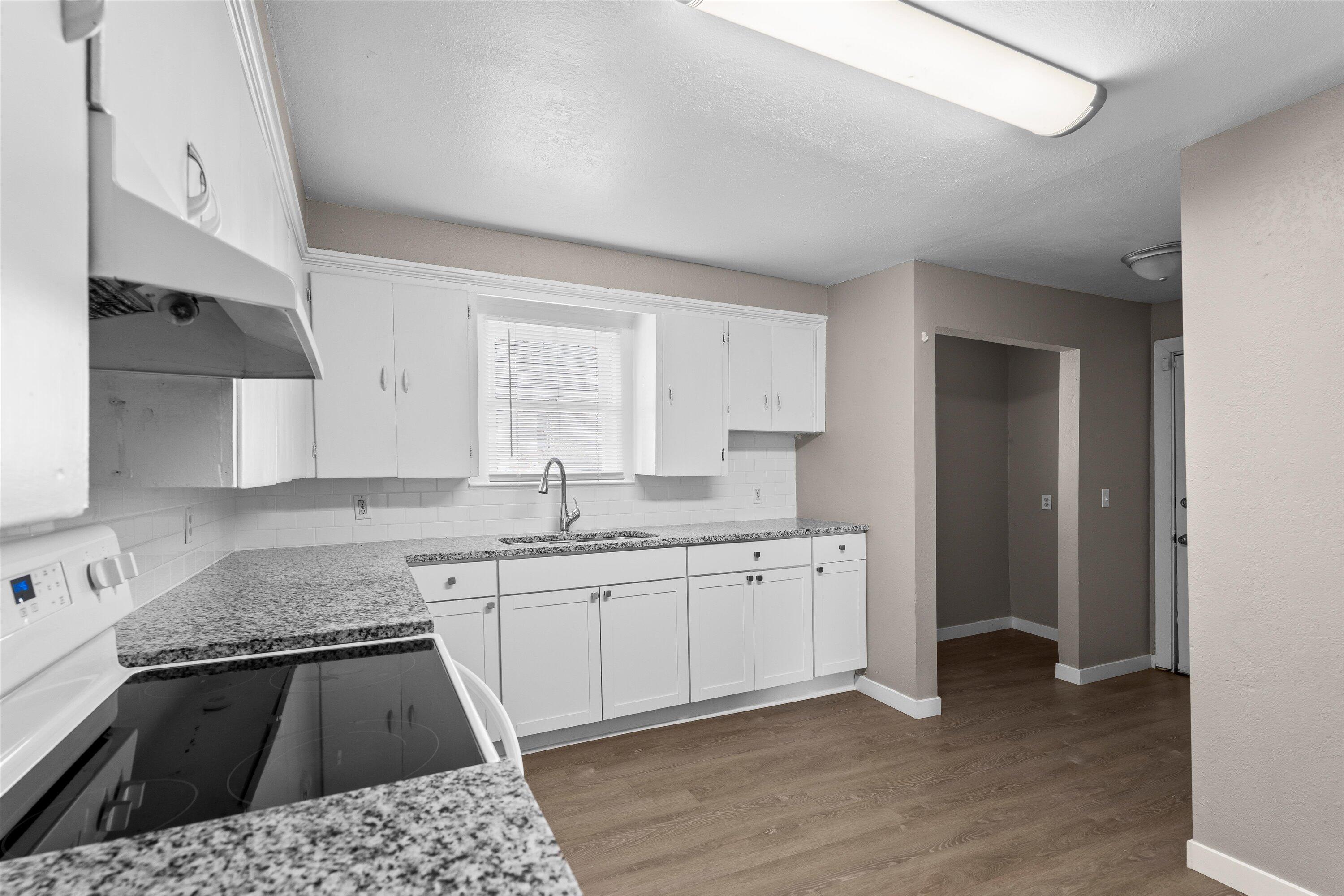 301 Austin Street Levelland, TX 79336 - Photo 5 of 18 a kitchen with a sink and cabinets
