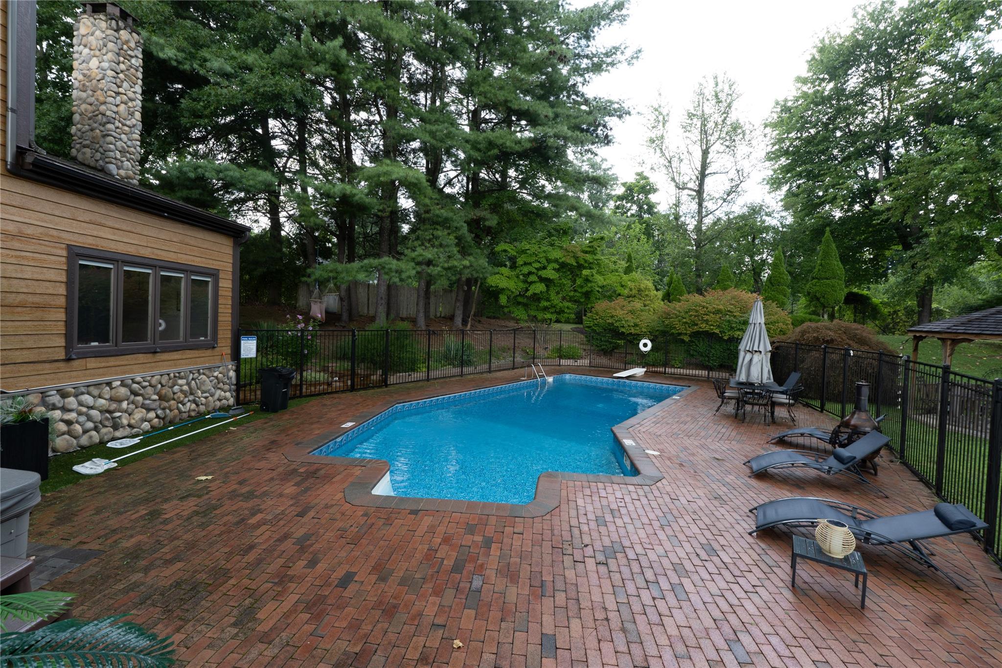 View of swimming pool with a patio area, a fenced backyard, and a fenced in pool