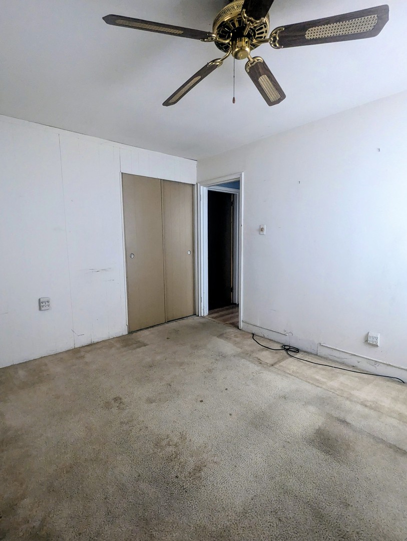 3253 Bernice Road Lansing, IL 60438 - Photo 10 of 20 a view of an empty room and a chandelier fan