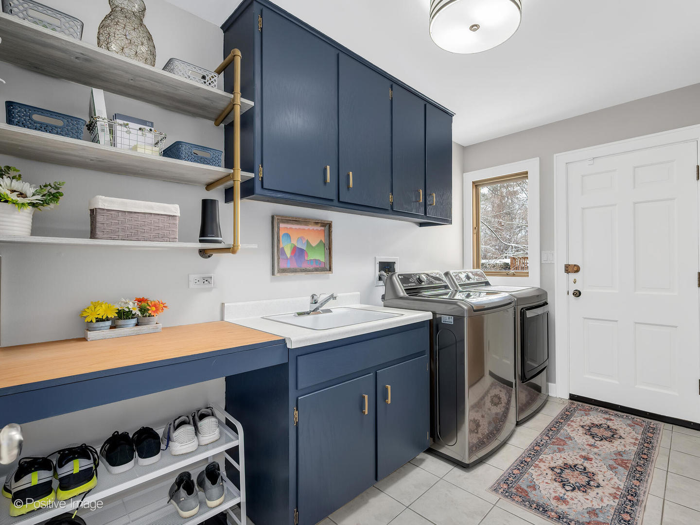 6555 Shabbona Road Indian Head Park, IL 60525 - Photo 29 of 63 a kitchen with a sink cabinets and appliances