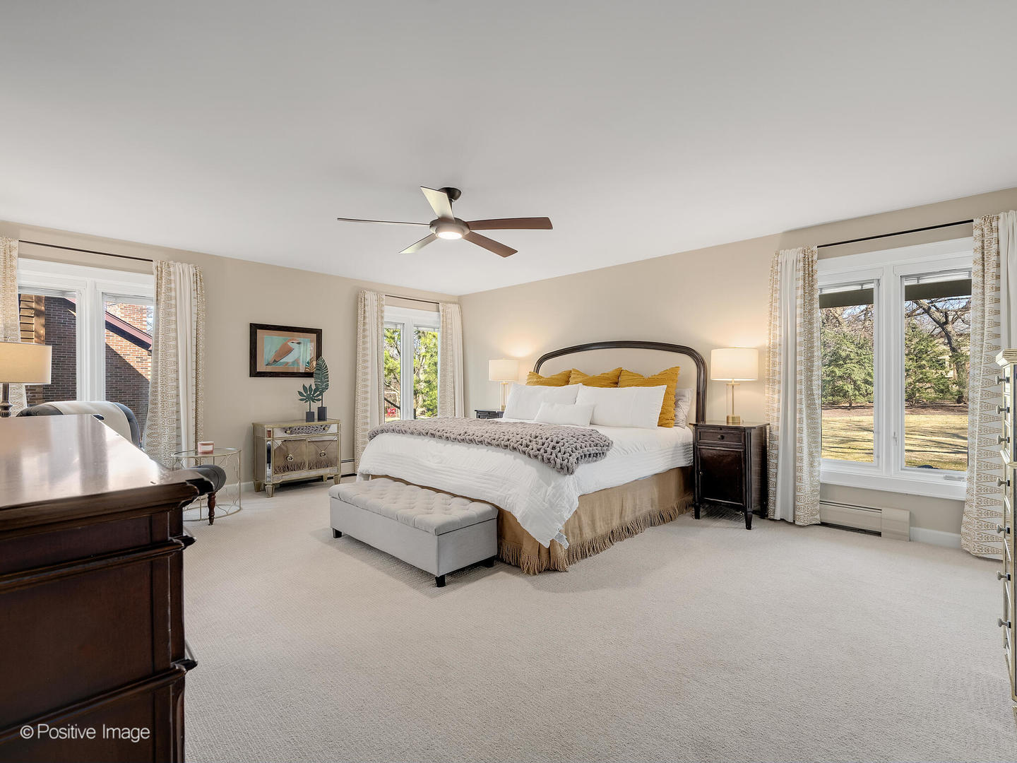 6555 Shabbona Road Indian Head Park, IL 60525 - Photo 30 of 63 a spacious bedroom with a bed a couch and dresser