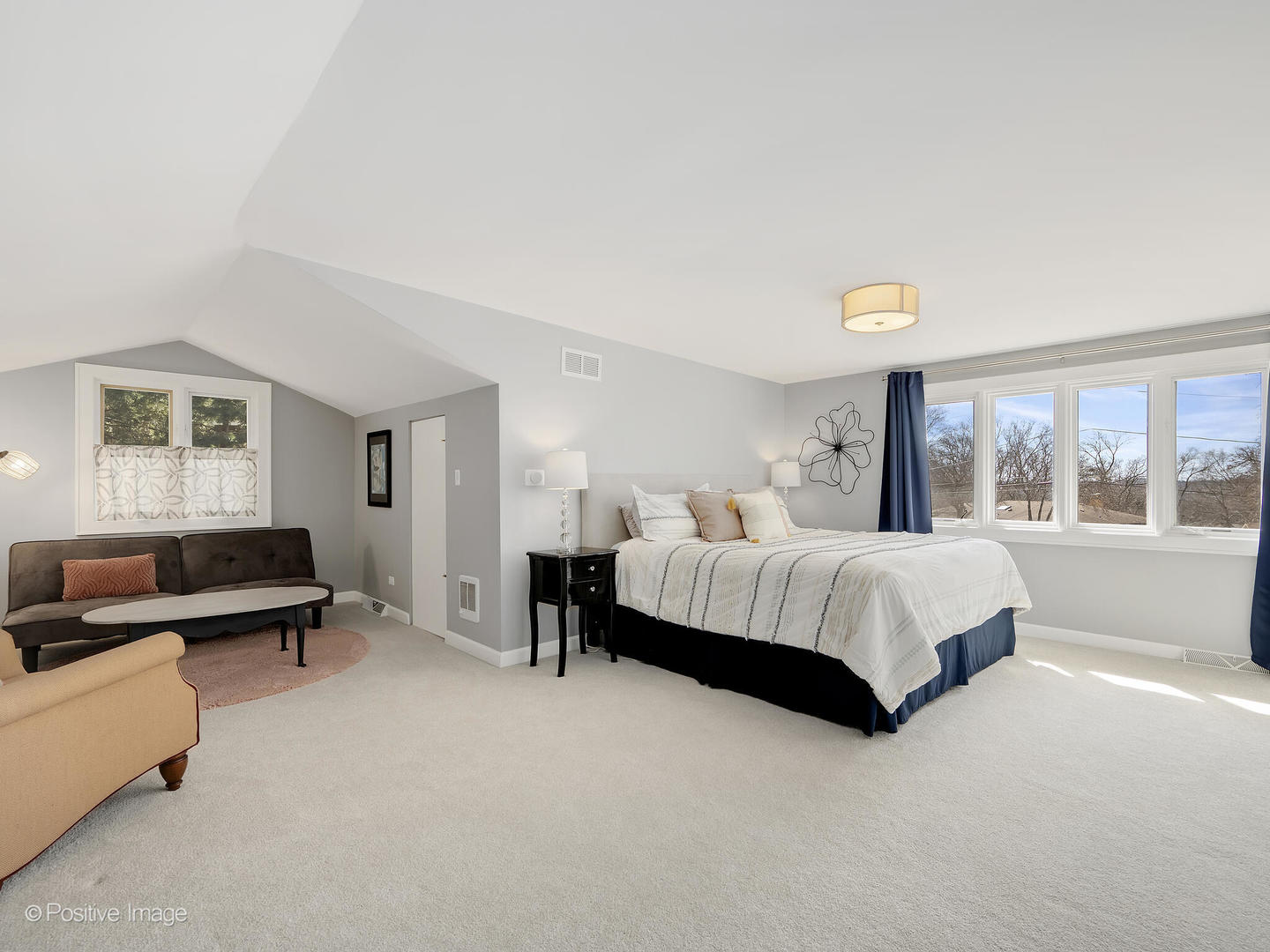 6555 Shabbona Road Indian Head Park, IL 60525 - Photo 40 of 63 a spacious bedroom with a bed and a couch