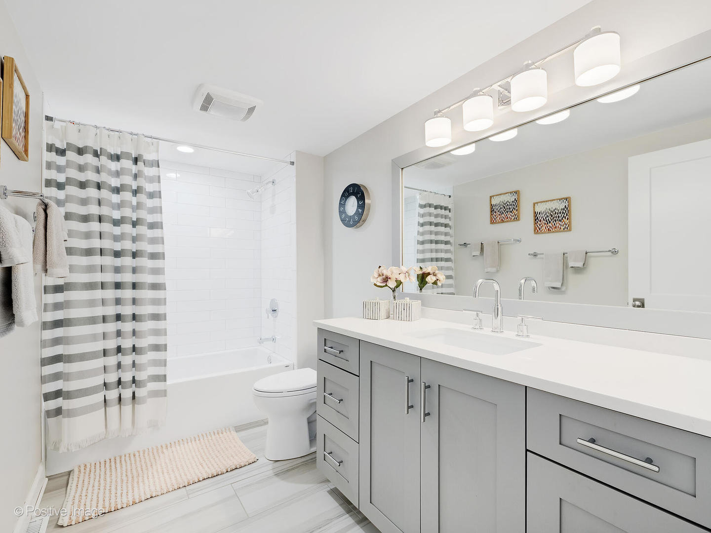 6555 Shabbona Road Indian Head Park, IL 60525 - Photo 42 of 63 a spacious bathroom with a sink a toilet a shower and a mirror