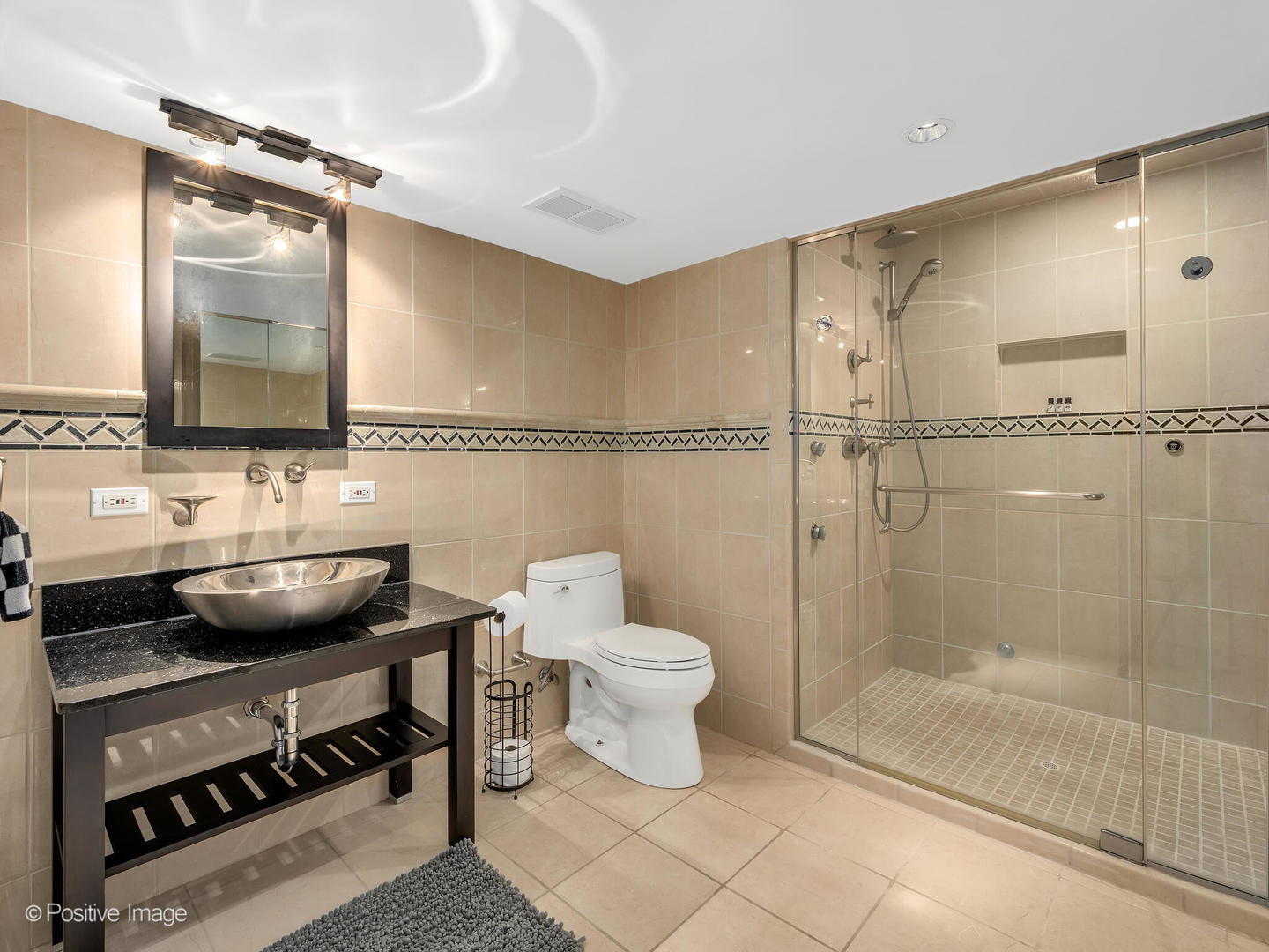 6555 Shabbona Road Indian Head Park, IL 60525 - Photo 51 of 63 a bathroom with a toilet a sink and shower