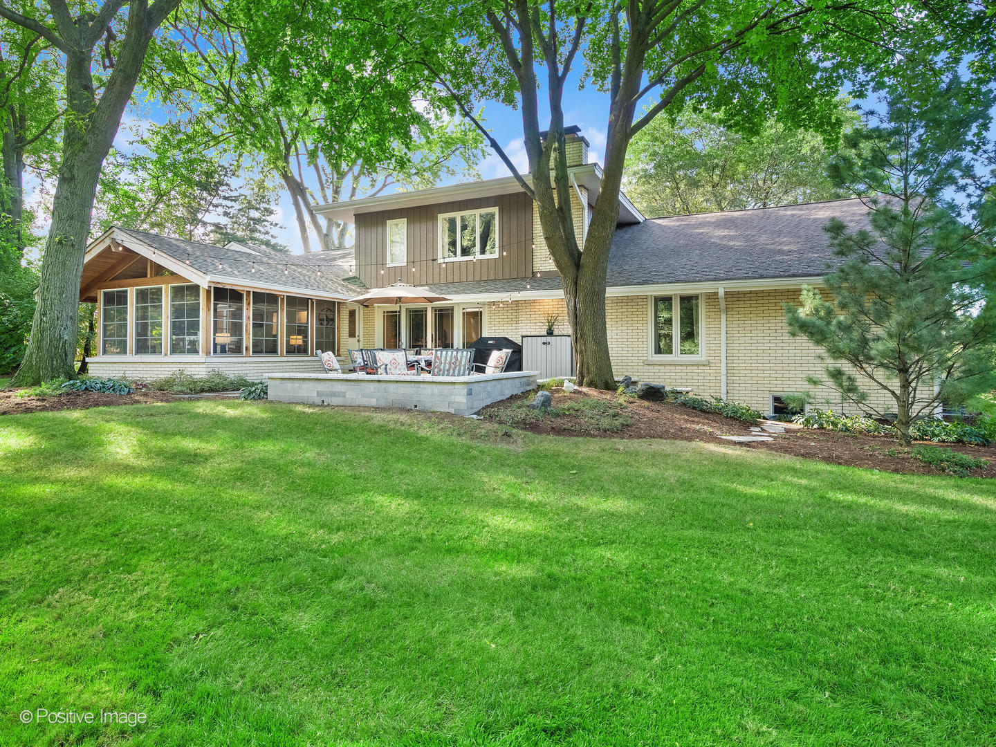 6555 Shabbona Road Indian Head Park, IL 60525 - Photo 57 of 63 a front view of a house with a yard and trees