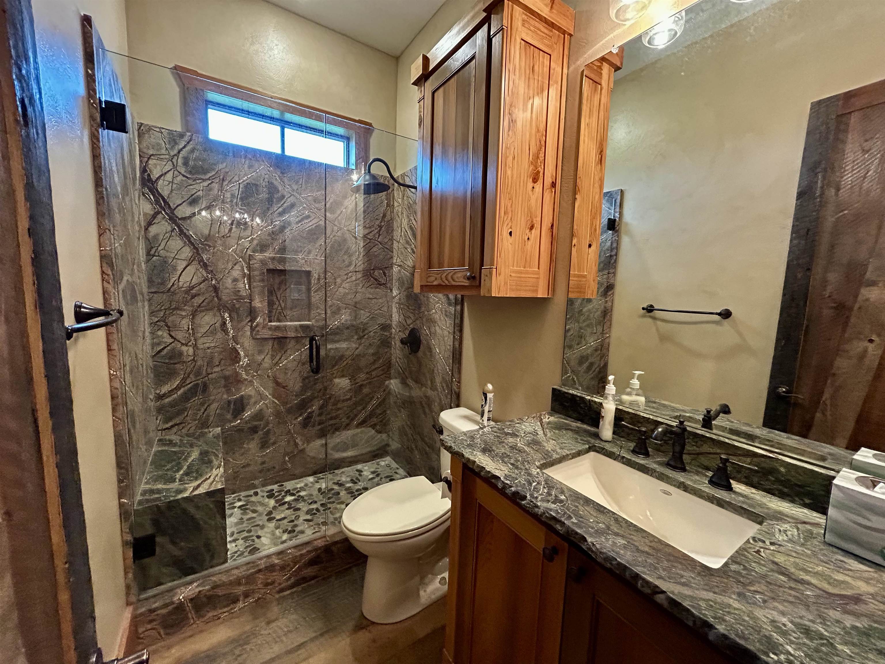 0 Alto Ranch Alto, TX 75925 - Photo 15 of 24 a bathroom with a granite countertop sink toilet and shower