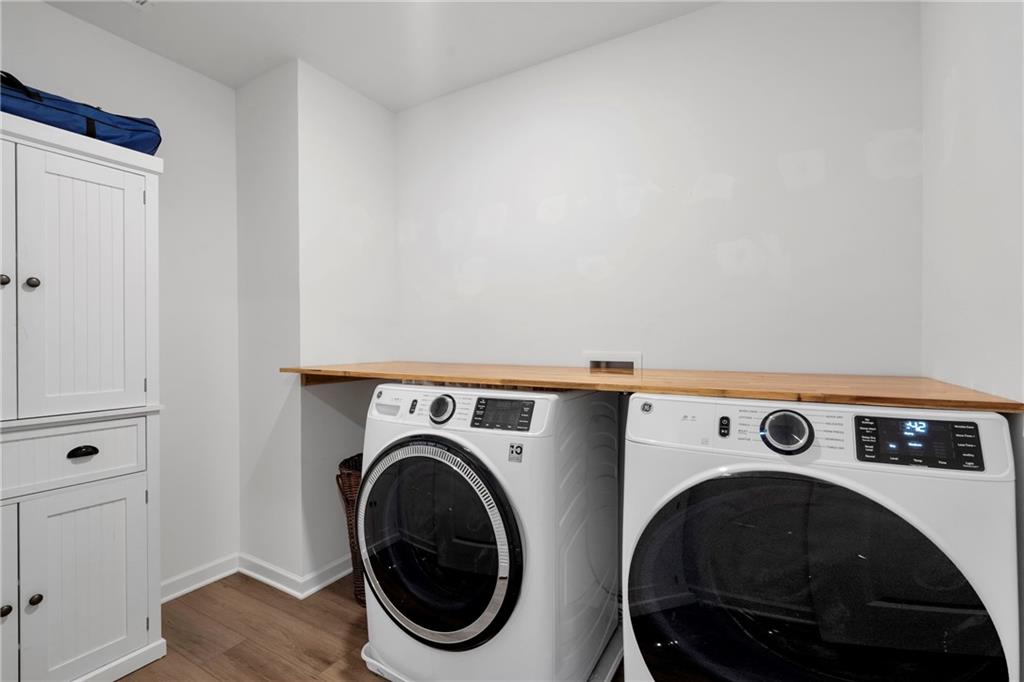 660 Groover Street Ball Ground, GA 30107 - Photo 29 of 53 a utility room with dryer and washer