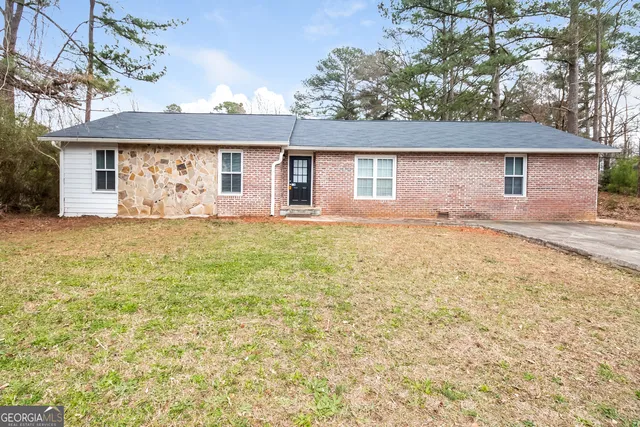 front view of a house with a yard