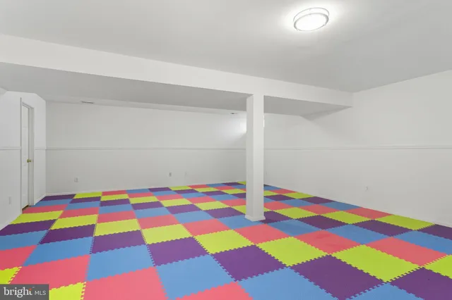 a and white checkered floor with a sink