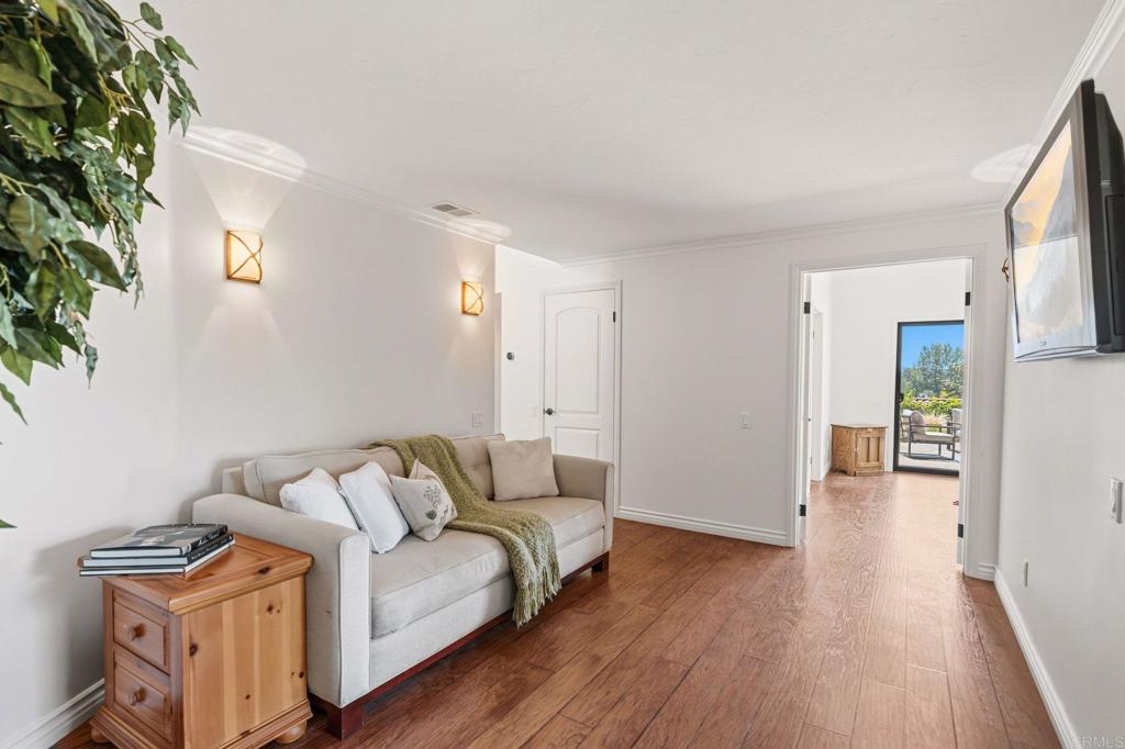 13319 Pacer Lane Poway, CA 92064 - Photo 34 of 75 a living room with furniture and a wooden floor
