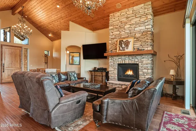 a kitchen with stainless steel appliances granite countertop a stove a refrigerator and a sink