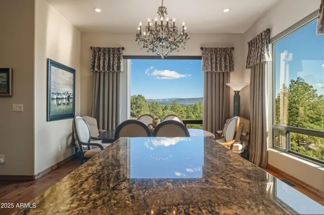a spacious bedroom with a bed and glass window
