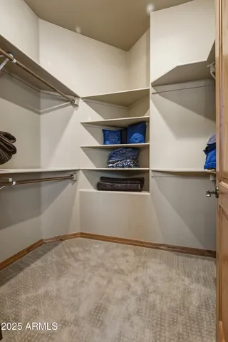 a room with pool table and windows