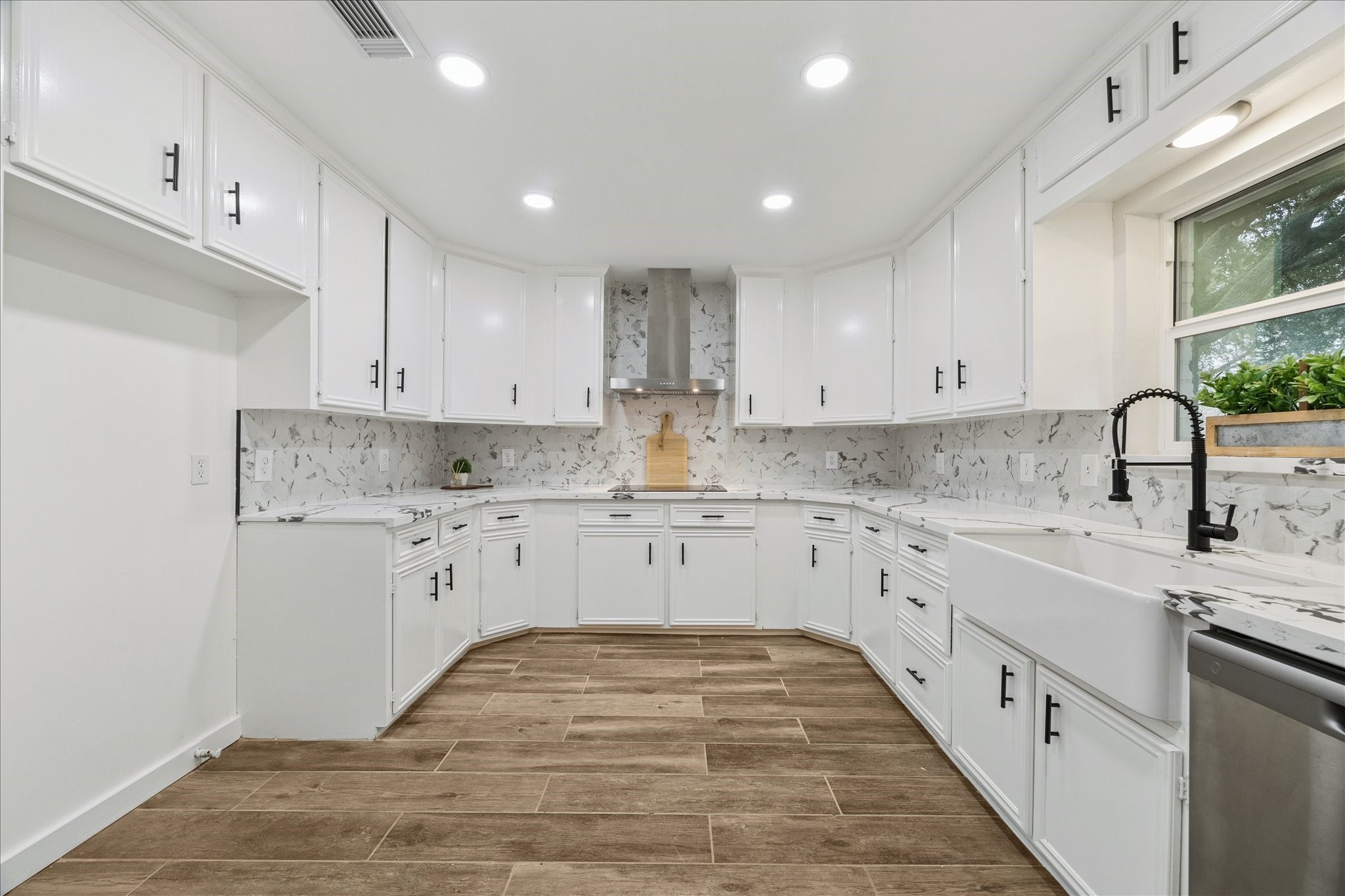 6911 Oak Lane Richmond, TX 77406 - Photo 13 of 42 a kitchen with sink and cabinets