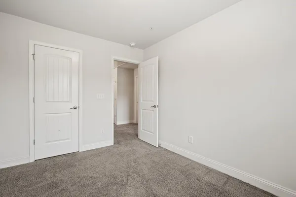 a kitchen with granite countertop a stove a sink and a microwave